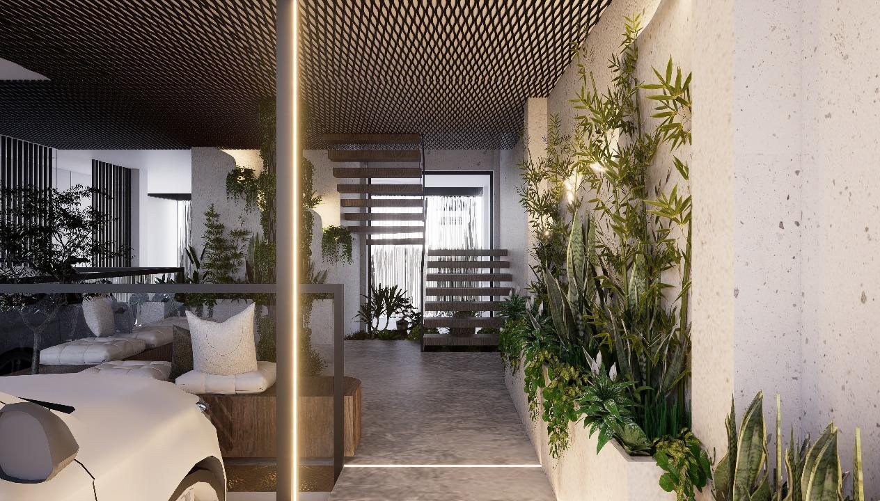 Hall de ingreso con jardín interior, banca de madera y escalera flotante
