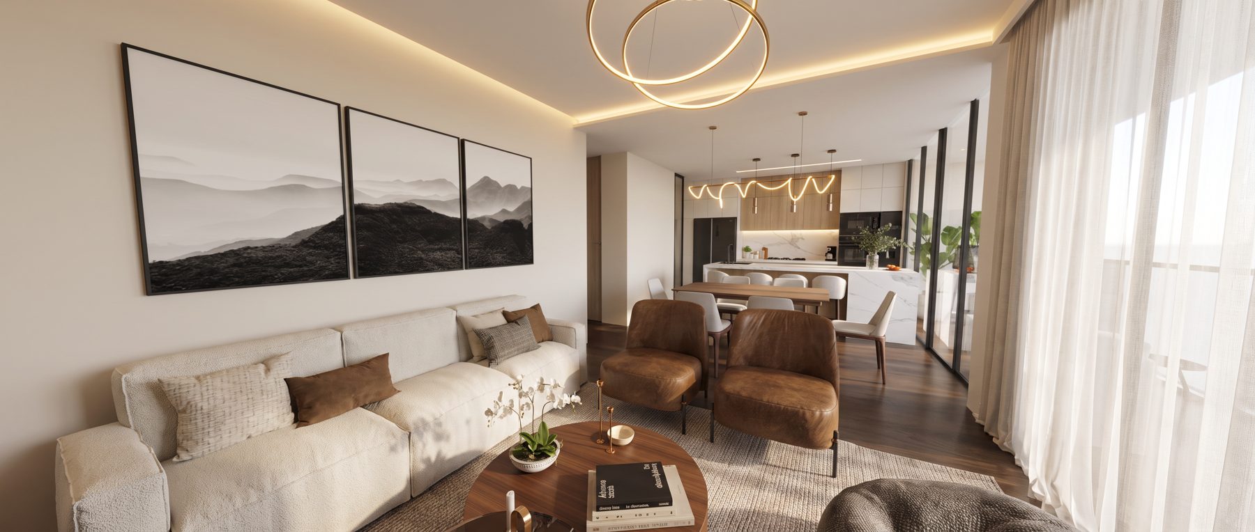Sala, comedor y cocina integrados con sofá blanco, sillones de cuero y lámpara de aros de latón